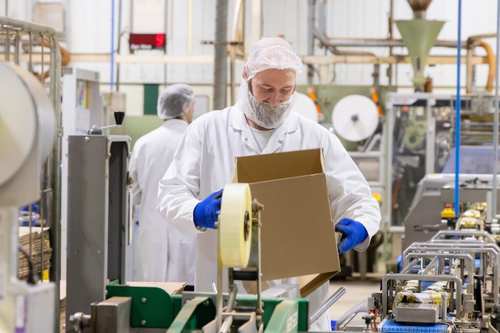 A Ringtons factory worker packing products