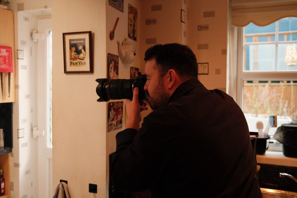 Cal, our photography partner, shooting stills in a customer's kitchen on the Ringtons doorstep campaign